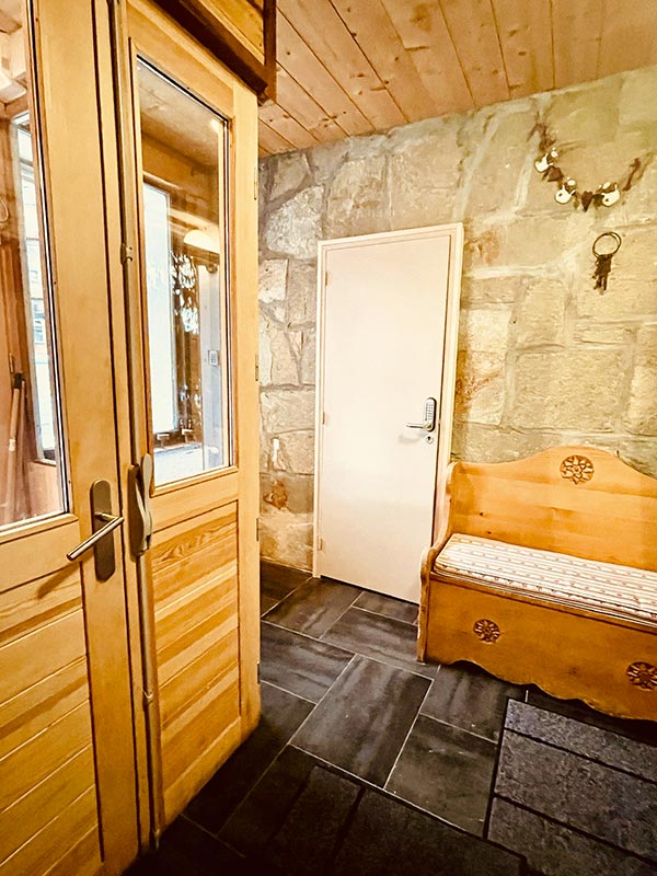 L'entrance of the Chalet overlooking l'Huez apartment, Alpe and the ski room of l'Huez apartment at l'Alpe d'Huez 1850 M ideal location