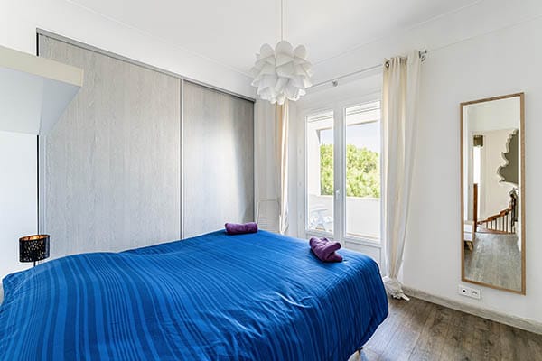 bedroom 1 of the seaside villa with a bed overlooking the Giens peninsula